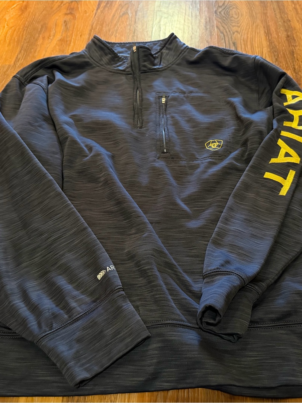Ariat Men's Black Quarter-Zip Pullover with Yellow Logo and Sleeve Text